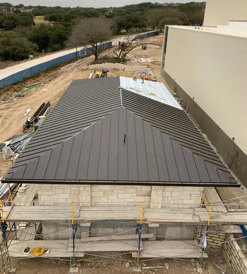 Metal roof new construction with scaffolding in Harpswell